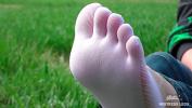 Video porn new Goddess feet in cute white socks with jeans on the spring grass field fastest of free